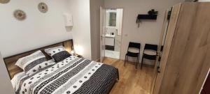 Posteľ alebo postele v izbe v ubytovaní Appartements - Halles Brauhauban Tarbes