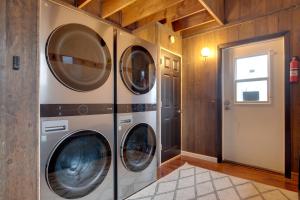 a laundry room with three washer and dryer at Iron River Retreat with Sauna Walk to Ski Brule! in Iron River