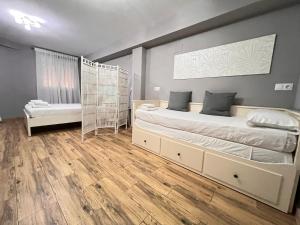 Posteľ alebo postele v izbe v ubytovaní Nuestra Casita de Marmoles Parking Incluido 2 bicis gratis