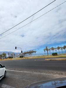 a car stopped at a traffic light on a street at El Pescador in Iquique