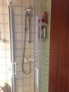 a shower in a bathroom with a glass door at Beachfront 3 Bedroom Family Apartment in Matalascañas