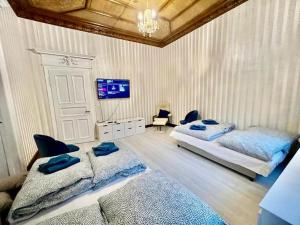 Ένα ή περισσότερα κρεβάτια σε δωμάτιο στο Villa Sartorius