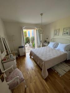 a bedroom with a large bed and a window at Villa Magnolia in Seillans