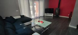 a living room with a couch and a glass table at Villa Veneziola La Manga in Murcia