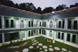 an exterior view of a building with a courtyard at Hotel Ágape in Marcala