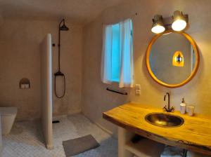 a bathroom with a sink and a mirror at Country house Mogador in Essaouira +25 photos