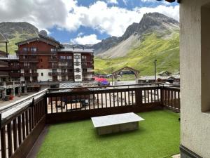 a balcony with a bench and a view of a mountain at TIGNES VAL CLARET A LA CONQUETE DES SOMMETS 116 in Tignes