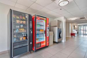 a large refrigerators in a room with drinks at Motel 6-Harlingen, TX in Harlingen