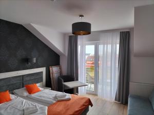 Postel nebo postele na pokoji v ubytování Pensjonat Latino + 30 fotografií