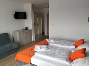 Łóżko lub łóżka w pokoju w obiekcie Pensjonat Latino