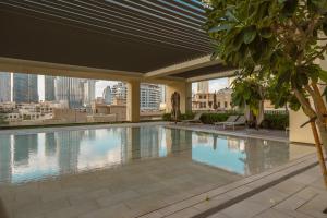 a swimming pool on the roof of a building at Prime Retreats @ Burj Royale By Emaar in Dubai