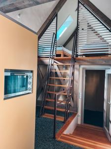a spiral staircase in a tiny house at Kyritzer Budenhaus (Nr. 107) in Kyritz