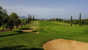 a view of a golf course with a green at Villetta con giardino in Genova