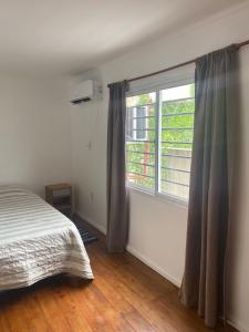 Giường trong phòng chung tại DEPARTAMENTO 2 Duplex equipado hasta 4 huéspedes