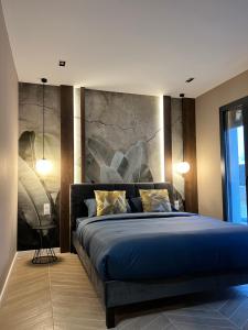 Un pat sau paturi într-o cameră la Villa Valentin 2 chambres avec jardin à Calvi