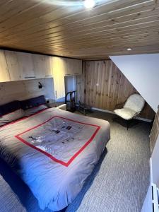 a bedroom with a bed and a chair in it at Stunning apartment with breathtaking view! in LʼHuez