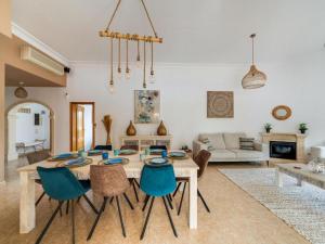 a living room with a table and chairs at Casa de la Buena Vida in Jávea