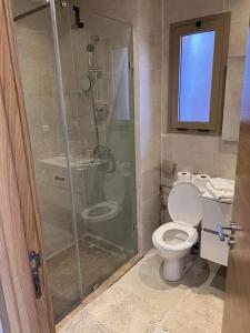 a bathroom with a shower and a toilet at Beautiful apartment in Golf City Marrakech in Marrakesh