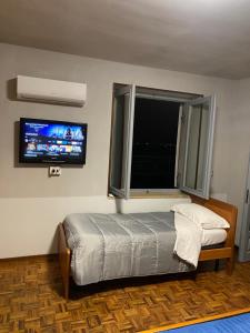 Postel nebo postele na pokoji v ubytování La casa di Cate & Adry