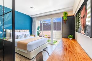 a bedroom with a bed and a table at Trendy Apartments in Palermo in Buenos Aires