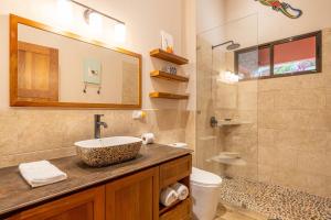 a bathroom with a sink and a shower at Villa Roca Ocean to Mountain Views - by Pura Villas in Ojochal +65 photos