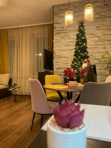 a living room with a christmas tree and a table at Studio Stankovic Royal Towers 326 in Bansko