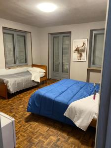 Postel nebo postele na pokoji v ubytování La casa di Cate & Adry