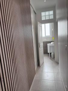 a bathroom with a toilet and a sink at Appartement Des Iles in Juan-les-Pins