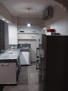 Kuchyňa alebo kuchynka v ubytovaní Bel appartement de 54 M² bien meublé situé au coeur de Marrakech et à proximité de toute commodité