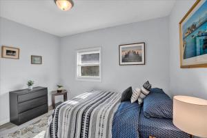 a bedroom with a bed and a dresser at Heart of Pocono Mtn 3bd 2ba Gameroom Pocono Raceway in Long Pond +46 photos