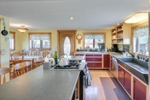 a kitchen with a stove and a counter top at Quiet Bradford Retreat Near Hiking and Fishing! 