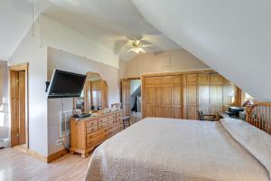 a bedroom with a bed and a flat screen tv at Quiet Bradford Retreat Near Hiking and Fishing! 