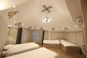 Postel nebo postele na pokoji v ubytování Cozy Hostel