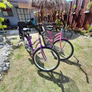 two bikes parked next to each other on the grass at Nuutea lodge in Avatoru