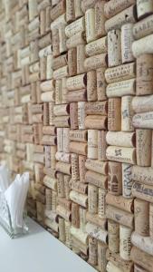 a pile of wine corks on a wall at Pousada Bella Vista - Vale dos Vinhedos in Bento Gonçalves
