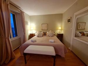 a bedroom with a large bed and a window at Villa Rosa Trois Epis in Trois-Épis