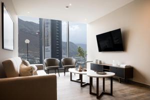 a living room with a view of a building at Lujo y comodidad a 2 min del consulado in Monterrey