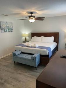 a bedroom with a bed and a ceiling fan at Cozy Stylish Townhome in Davenport