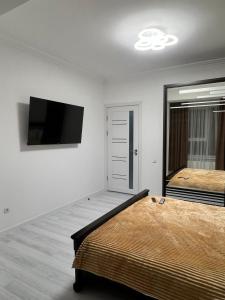 A bed or beds in a room at Luxury Aparts