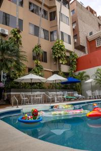 a swimming pool with inflatables in a hotel at Aparthotel Guijarros in Tegucigalpa