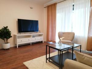 A television and/or entertainment centre at Apartment SiLa