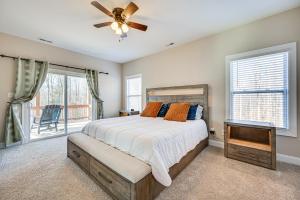 a bedroom with a bed and a ceiling fan at Home Gym and Fireplace Roaring River Retreat in Roaring River
