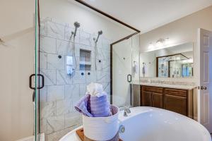 a bathroom with a tub and a shower at Home Gym and Fireplace Roaring River Retreat in Roaring River +23 photos