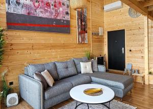 a living room with a couch and a table at Villa Tramonto D'Oro in Ulcinj +17 photos
