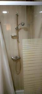 a shower in a bathroom with a shower curtain at Sousse kantaoui tunisia in Hammam Sousse