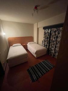 Säng eller sängar i ett rum på Porto Sokhna Pyramids Apartments