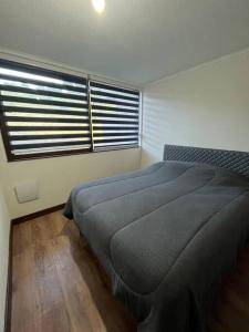 Łóżko lub łóżka w pokoju w obiekcie Maravilloso Departamento en Llanquihue