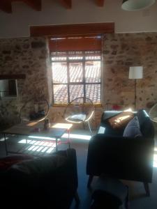 a living room with a couch and a window at Casa Buscareta in Montán +36 photos