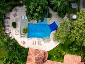 an aerial view of a pool in a resort at Kantawa Hotel & Spa - Solo Adultos in Calabazo