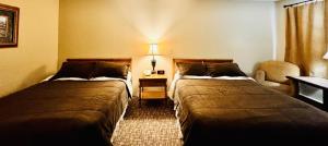 Postel nebo postele na pokoji v ubytování Fundy Line Motel